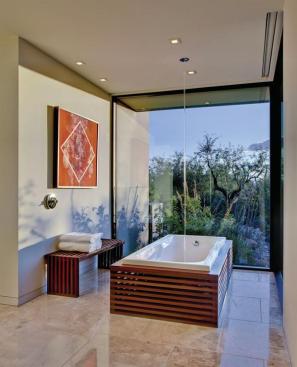 An+ipe-clad+bathtub+and+a+wall-height+glass+window+with+garden+views+reinforces+this+master+bath%27s+connection+to+the+outside.