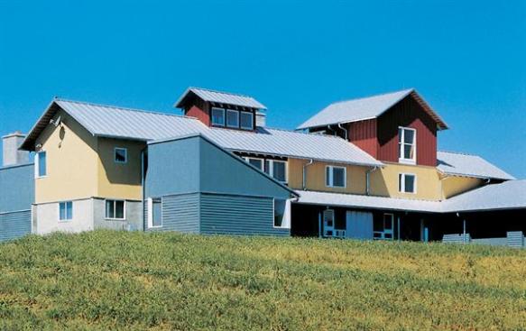 Assembled as something of a collage of rural building types, this weekend home brings a sophisticated urban sensibility to its pastoral setting.