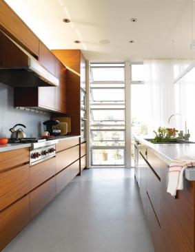 The west wall takes in broad views of Ballard Cut, the waterway for which the house is named.