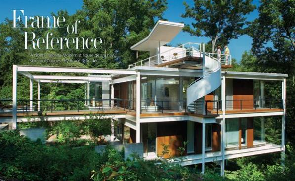 An existing steel structure serves as the armature for an enclosure of glass curtain walls and Cor-ten steel siding panels