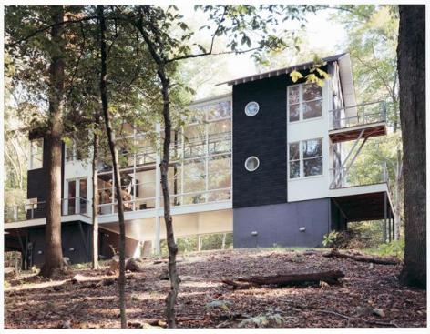The client for this rural Maryland house wanted a no-frills design that would live in harmony with the forest around it. McInturff Architects responded with a plan based on a simple bridge structure. 
