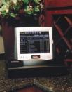 The wireless CorAccess Web Pad from Home Director is just one element of a complete home control system, which provides services such as whole-house Internet access, sound control, interactive television, and digital photo management.