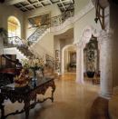 This entry shows off low-maintenance interior flooring, and wide hallways and stairs.