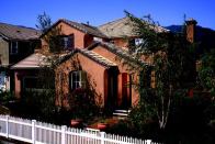 SPANISH STYLING: Plan 2, with its rich, terra-cotta–colored detailing, is the Summit's most popular model. Buyers love the entry courtyard and the office/den option at the front of the home.