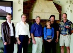 BUILT RIGHT: Alex and Jan Hannigan (above, third and fourth from the left) led an on-site team that included (from left) structural engineer Lee Smith of Engineering Services Group; interior designer and merchandiser Donnie Saxon of Saxon-Clark Furniture and Design; Scott Redmon, owner of landscape architecture firm Redmon Design Co.; and Tom Davis, production manager for Hannigan Homes.