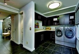 In the back of the plan is a mudroom (above) that enables the occupants to unload groceries brought in from the detached garage, which is separated from the house by a trellised pool area and garden (below), before taking the elevator to the third-level kitchen.