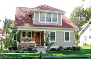 SEE AND BELIEVE: New England buyers are generally averse to detached garages, but that hasn't  stopped Leslie Clement from building them. “They look nicer, and the  end result is a friendlier looking street,” she says.