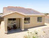 Photovoltaic shingles on the rear of a home in Beazer's Terraza at Villago in Phoenix collect solar energy that homeowners will lease from SolarCity.