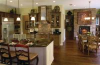 GEOMETRY LESSON: The Genesis Collection concentrates dollars and square footage where people spend most of their time. The social spaces in each plan form a "lifestyle triangle"--an interactive spatial dynamic among kitchen, cafe eating area, and informal living space.