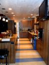 The kitchen ceiling features lumber made from trees taken from the front yard that were milled, kiln-dried in about 60 days, and stained.