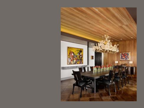 The dining room ceiling features hand-painted wallpaper.
