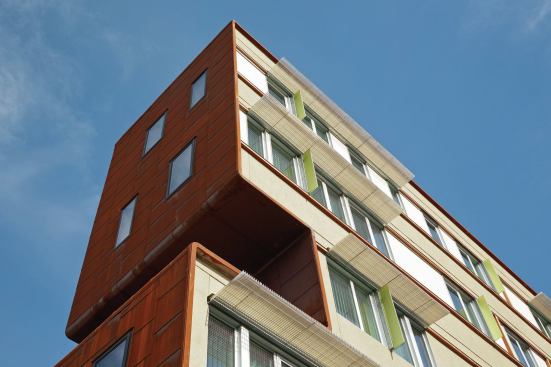 On the larger building, accents of color add liveliness and warmth. 