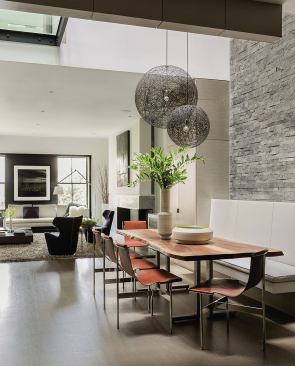 This gut-remodeled apartment centers on a three-story, skylit atrium.