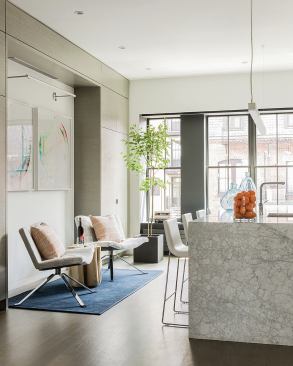 The kitchen, which includes a casual seating area, is designed to accommodate parties as well as day-to-day functions.