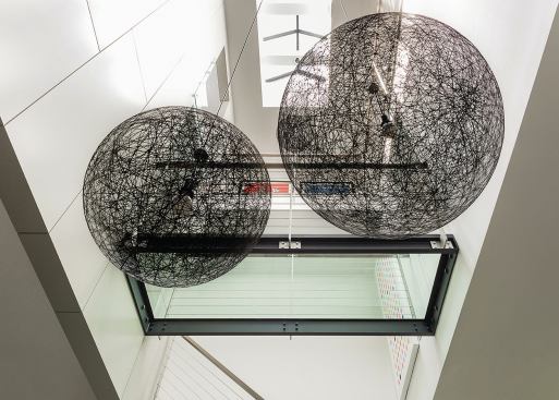 The atrium rises 38 feet, to the roof of the 6-story building.