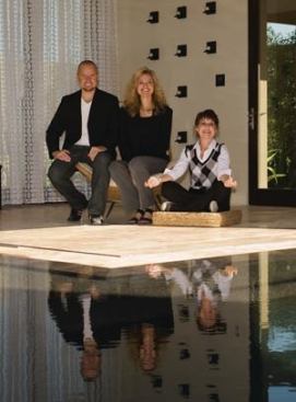 THE INTERIOR DESIGNER: Striking a meditative pose, Lee Lundquist 
(right) and her team from Robb & Stucky Interiors were brought into 
the process early and often and created a comfortable balance to the 
home’s clean, modern lines—as well as a taste of nostalgic Vegas style. 
“We didn’t want the house to be too serious and uncomfortable,” says 
Lundquist, joined by associates Kevin Johnson, far left, and Kellie 
Miller, center.