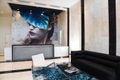 Eve portrait by artist Anna Sweet in the reception area.