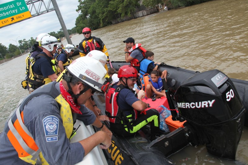 Members of FEMA's Urban Search and Rescue Nebraska Task Force One (NE-TF1) rescue a family&nbsp;from a neighborhood impacted by&nbsp;flooding from Hurricane Harvey
