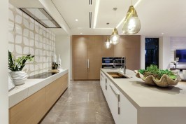 Shimmering, high-gloss finishes, double kitchen islands, and open living spaces are among 2017's biggest home trends, says designer Marc Thee.