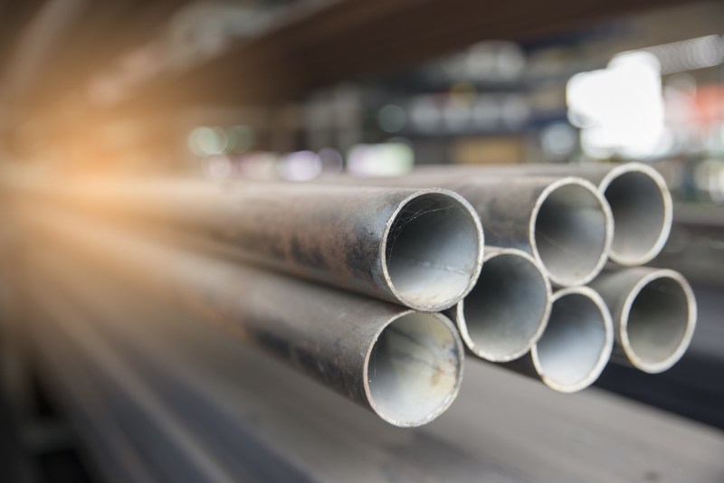 Steel pipes used for construction in warehouse.