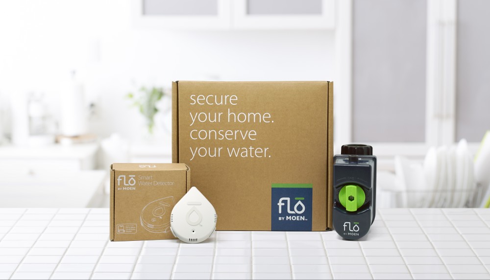 The Flo by Moen Smart Water Detector, shown left with the Flo by Moen Smart Water Shutoff.