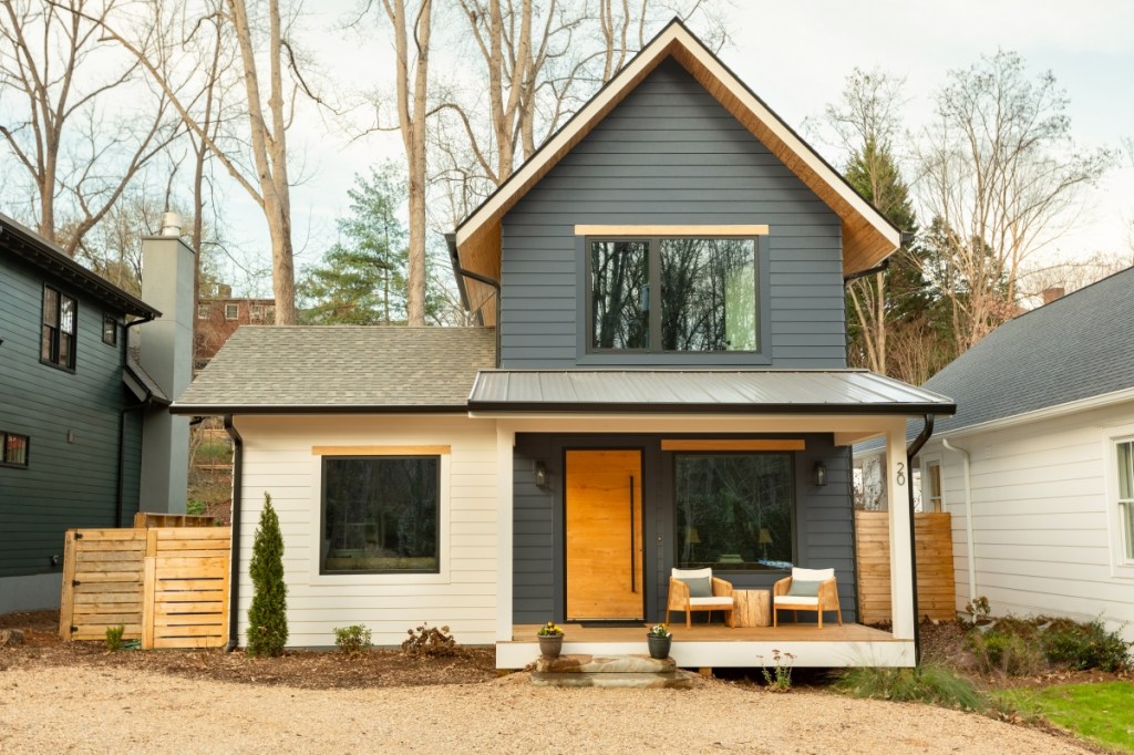 A house with a wood fence and a wood fence