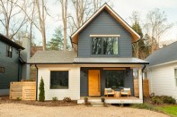 A house with a wood fence and a wood fence