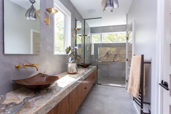 Master bath: Shadow Onyx at vanity countertop with mitered edge along vanity face, at shower bench, and for the shower back panel; Resing Berlin Grey tile for the floor, vanity wall, and shower.
