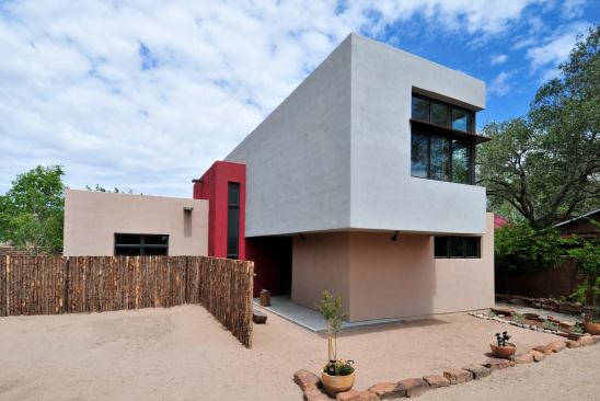 The clients were moving back to the States to retire, after years of living and working in Asia, and they’d amassed a&nbsp;large collection of&nbsp;folk art that had to be shipped back home. Shipping containers and houses made from them helped inspire the exterior design.