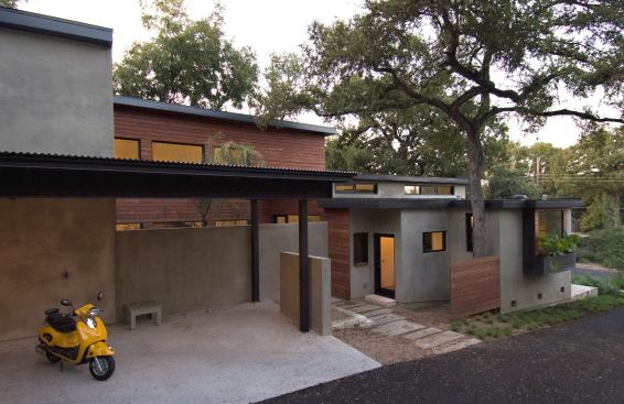 The Post Oak Retreat by architect Camille Urban Jobe is a 2,250-square-foot SIP house that was built on a tight lot in an established Austin, Texas,&nbsp;neighborhood. It features a stucco exterior, a Brazilian hardwood rainscreen, and a steel plate rainscreen.