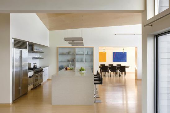 View from foyer looking across the open kitchen into the dining room.