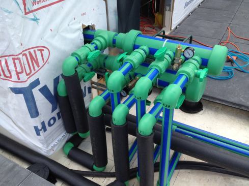 The sub-zones connect to the system at the main manifold (shown), which connects to the pumps, heat exchanger, and geothermal system located in the basement.