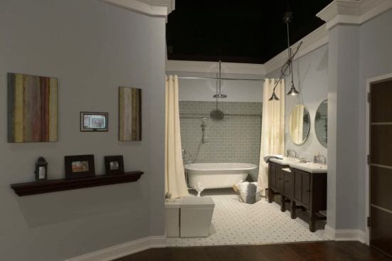 The bathroom is a mixture of old and new with an old-fashioned soaking tub filled with low-flow fixtures with electronic controls for temperature and timing.