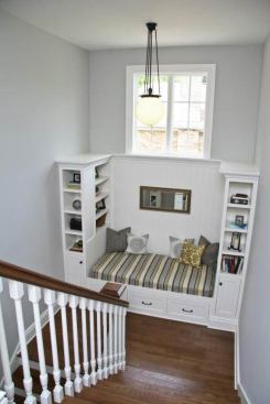 Bookshelves and a window seat turn the stair landing into a destination of its own.