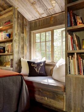 Built-ins with window seat, drawer, cabinets, and bookshelves