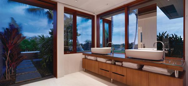An alfresco tub beckons outside the master bath. 