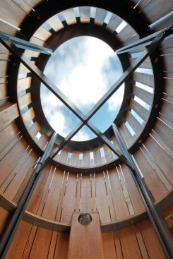 2014 Grand, Bath Detail: Aucoot Cove Outdoor Shower by Hutker Architects Once the steel frame had been lowered onto the porch, the team rotated it until the structural crossbars were in perfect alignment with the orthogonal points of a compass.