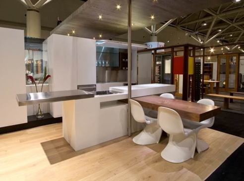 Modeled after a Swiss army knife, this kitchen island has a retractable table and cutting board that make it ideal for small spaces.