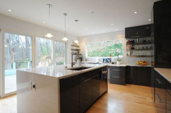 Windows and doors with ultra-clean lines enhance the new kitchen’s clean, modern architecture.