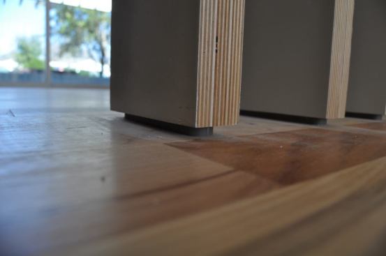 Spacing them off the floor was a challenge. We made an oak “biscuit” then slotted the screens to fit over them.
