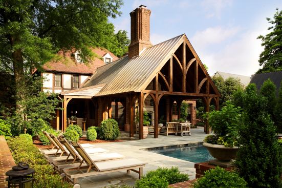 The rustic timber frame of this porch addition allows for aesthetic variety while keeping in step with the home’s Tudor style. To avoid a just-added look, the team included a new chimney that mirrors an existing chimney on the rear of the home, providing an outdoor fireplace that keeps that porch functional all year long. Project: Hardly Porch/Pool Addition, Richmond, Va.; Builder: Tuckahoe Creek Construction, Manakin-Sabot, Va.; Architect: Cox & Associates, Richmond; Designer: Lost Bent Woodworking & Design, Riner, Va.