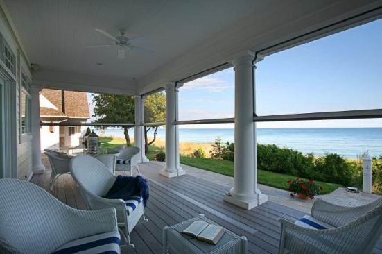 Retractable Phantom screens keep bugs away from the porch without blocking views.