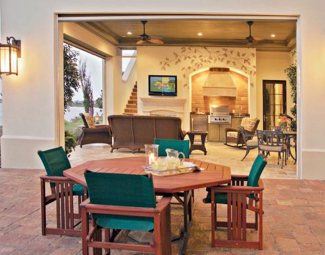 COVERED COMFORT: The downstairs loggia (seen in the background) offers plenty of casual seating area under its ample cover, as well as a pest-control screen and wide-open access to the pool terrace.