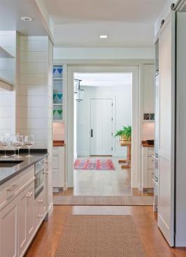Equipped as a secondary kitchen, the butler's pantry organizes circulation and activities as well as food.