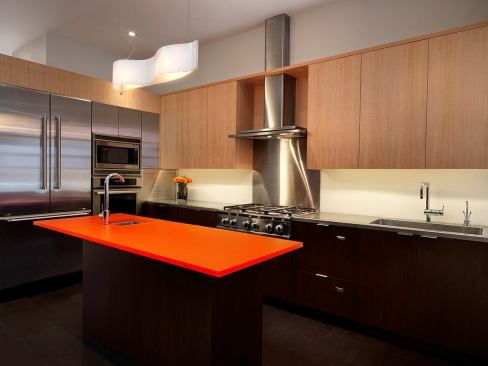 After: The kitchen was moved to the center of the main level in what used to be the dining room.   2011 Remodeling Design Awards (September)  Whole-House Remodeling $250,000 – $500,000  Kube Architecture, Washington, D.C.