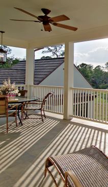 SCENIC OVERLOOK: A breezy balcony off the master suite sits on top of the loggia and above the pool, facing west. It's an ideal spot for bird-watching over morning coffee.