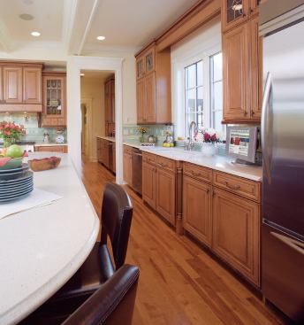 INCLUSIONARY ZONING: No one gets voted off the island in this kitchen. With its ample girth and durable Silestone countertop, the all-purpose workstation's got room for everyone. Kids can tackle homework, Grandma can roll out a piecrust, and Mom can make a salad for dinner—all with no elbow bumping.