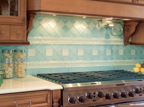 GLASS MENAGERIE: Nothing makes a backsplash come alive like glass tiles. Crossville’s Illuminessence glass line makes the areas behind the range really pop. The wall is anchored by 3-inch-by-3-inch Prism Glass field tiles with Sea Glass Surf and Icicle listels. The pieces are made from cast translucent glass that contains a percentage of recycled glass. www.crossvilleinc.com