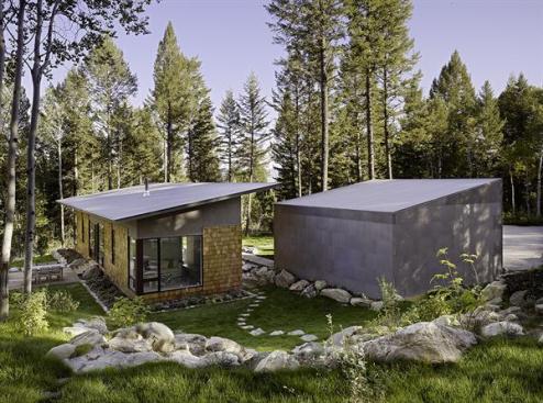 Solar panels wouldnt have made sense for this site, which receives substantial shade. Carney and builder Kurt Wimberg focused instead on building a tight, superinsulated envelope with a high-efficiency heating system.