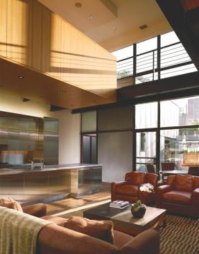 Discrete, box-like volumes clad in elm veneer and stainless steel allow the building's simple interior geometry to read through.